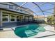 Inviting kidney-shaped pool with screened enclosure at 1713 Fullers Oak Loop, Winter Garden, FL 34787