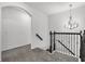 Elegant staircase with wrought-iron railing leading to the second floor at 1713 Fullers Oak Loop, Winter Garden, FL 34787