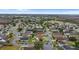 Aerial view of a residential neighborhood with houses and a lake at 1820 Putney Cir, Orlando, FL 32837