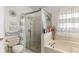 Bathroom with shower, tub, and double vanity at 1820 Putney Cir, Orlando, FL 32837