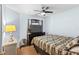 Bedroom with double bed, ceiling fan, and wood dresser at 1820 Putney Cir, Orlando, FL 32837