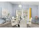 Dining area with glass table and white chairs, overlooking the pool at 1820 Putney Cir, Orlando, FL 32837