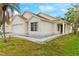 Side view of a one-story house with a two-car garage at 1820 Putney Cir, Orlando, FL 32837