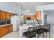 Kitchen with light wood cabinets and white appliances at 1820 Putney Cir, Orlando, FL 32837