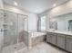 Bathroom features a soaking tub, double vanity, and shower at 1870 Dumbleton Pl, St Cloud, FL 34771