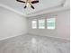 Bright bedroom with tile floors and large windows at 1870 Dumbleton Pl, St Cloud, FL 34771