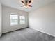 Well-lit bedroom with two windows and ceiling fan at 1870 Dumbleton Pl, St Cloud, FL 34771