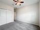 Bedroom with double closet and ceiling fan at 1870 Dumbleton Pl, St Cloud, FL 34771