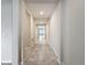 Bright hallway with tile flooring, leading to living areas at 1870 Dumbleton Pl, St Cloud, FL 34771