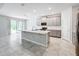 Open concept kitchen with island and gray cabinets at 1870 Dumbleton Pl, St Cloud, FL 34771