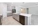 Modern kitchen with island, gray cabinets and a dishwasher at 1870 Dumbleton Pl, St Cloud, FL 34771