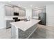 Spacious kitchen featuring gray cabinets and a large island at 1870 Dumbleton Pl, St Cloud, FL 34771