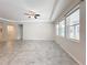 Spacious living room featuring tile floors and a ceiling fan at 1870 Dumbleton Pl, St Cloud, FL 34771