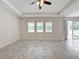 Living room with tile floors, sliding glass doors and windows at 1870 Dumbleton Pl, St Cloud, FL 34771