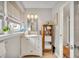 Bright bathroom with white vanity, large mirror, and ample storage at 1871 Linden Rd, Winter Park, FL 32792