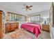 Charming bedroom with a large bed, wooden dresser, and area rug at 1871 Linden Rd, Winter Park, FL 32792