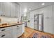 Modern white kitchen with wood countertops and stainless steel appliances at 1871 Linden Rd, Winter Park, FL 32792