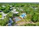 Aerial view of community with pool, shuffleboard, and lush landscaping at 2010 Brookside Dr, Mount Dora, FL 32757