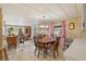 Small dining area with wood table and chairs, adjacent to kitchen at 2010 Brookside Dr, Mount Dora, FL 32757