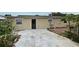 Home's backyard with a large concrete patio at 2090 Ashland Blvd, Orlando, FL 32808