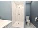 Bathroom with shower, toilet, and tiled walls at 2090 Ashland Blvd, Orlando, FL 32808