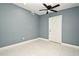 Simple bedroom with ceiling fan and tiled floors at 2090 Ashland Blvd, Orlando, FL 32808