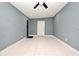 Spacious bedroom with tiled floors and two doors at 2090 Ashland Blvd, Orlando, FL 32808