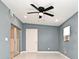 Bedroom with ceiling fan, tiled floors and sliding glass doors at 2090 Ashland Blvd, Orlando, FL 32808