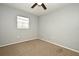 Well-lit bedroom featuring neutral walls, ceiling fan and carpet flooring at 2090 Ashland Blvd, Orlando, FL 32808