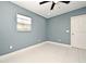 Bedroom with ceiling fan, window, and tiled floors at 2090 Ashland Blvd, Orlando, FL 32808