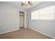 Simple bedroom with neutral walls, ceiling fan, and carpet flooring at 2090 Ashland Blvd, Orlando, FL 32808