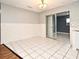 Simple dining area with tile flooring and access to other rooms at 2090 Ashland Blvd, Orlando, FL 32808