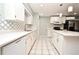 Clean kitchen with white cabinets and stainless steel appliances at 2090 Ashland Blvd, Orlando, FL 32808