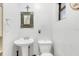 Simple bathroom with pedestal sink and toilet at 2100 Suffield Dr, Winter Park, FL 32792