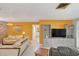 Living room with gray media cabinet and comfortable seating at 2100 Suffield Dr, Winter Park, FL 32792