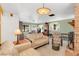 Spacious living room featuring a light beige couch and a brick fireplace at 2100 Suffield Dr, Winter Park, FL 32792