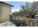 Private balcony overlooking tree-lined street with partial view of neighborhood at 2409 Kilgore St, Orlando, FL 32803