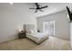 Main bedroom with a queen-size bed and access to a private balcony at 2409 Kilgore St, Orlando, FL 32803