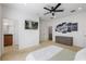 Bright bedroom with ensuite bathroom access, large TV, and ample closet space at 2409 Kilgore St, Orlando, FL 32803