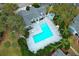 Aerial view of community pool, spa, and surrounding landscaping at 2580 Grassy Point Dr # 102, Lake Mary, FL 32746