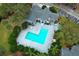 Aerial view of community pool, spa, and surrounding landscaping at 2580 Grassy Point Dr # 102, Lake Mary, FL 32746