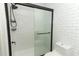 Modern bathroom with subway tile shower and black accents at 2580 Grassy Point Dr # 102, Lake Mary, FL 32746