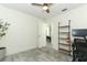 Bright home office features wood shelving and a view to the dining room at 2580 Grassy Point Dr # 102, Lake Mary, FL 32746