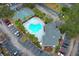 Aerial view of kidney-shaped pool, hot tub, and parking at 2580 Grassy Point Dr # 102, Lake Mary, FL 32746