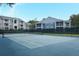 Community tennis court near residential buildings at 2580 Grassy Point Dr # 102, Lake Mary, FL 32746