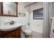 Clean bathroom with a tub, shower, and wood vanity at 2585 Northland Rd, Mount Dora, FL 32757