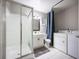 Bathroom with shower/tub combo, toilet and laundry at 2585 Northland Rd, Mount Dora, FL 32757