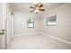 Well-lit bedroom with tile floors and ceiling fan at 2585 Northland Rd, Mount Dora, FL 32757