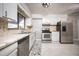 Kitchen with stainless steel appliances and white cabinets at 2585 Northland Rd, Mount Dora, FL 32757