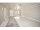 Bright living room with tile floors and neutral color palette at 2585 Northland Rd, Mount Dora, FL 32757